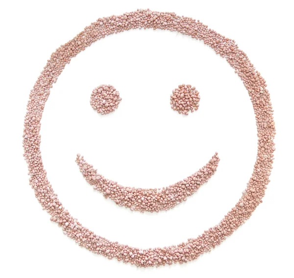 미소 형태로 비료 종자 — 스톡 사진